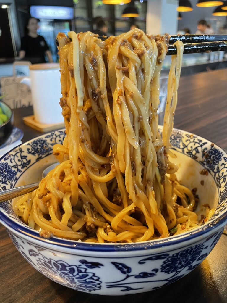 Handmade Chinese noodles in Frankfurt, served in a bowl with chopsticks
